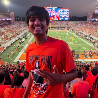 Aarush Jalan smiling at a Fighting Illini football game