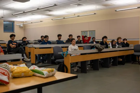 SIGecom members seated in a lecture hall during a general meeting