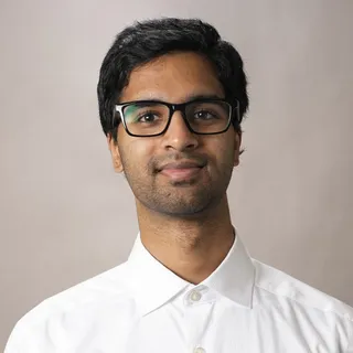 Sriram Koritala wearing glasses and a white shirt
